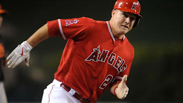May 20, 2016; Anaheim, CA, USA; Los Angeles Angels center fielder Mike Trout (27) reaches home to score a run in the sixth inning against Baltimore Orioles at Angel Stadium of Anaheim. Mandatory Credit: Gary A. Vasquez-USA TODAY Sports