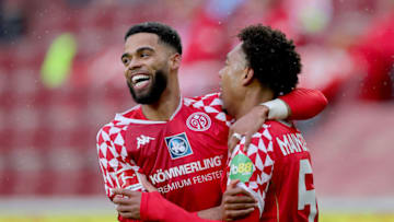 COLOGNE, GERMANY - APRIL 11: Jean-Paul Boetius of 1. FSV Mainz 05 celebrates with Jeremiah St. Juste after scoring their side's first goal during the Bundesliga match between 1. FC Koeln and 1. FSV Mainz 05 at RheinEnergieStadion on April 11, 2021 in Cologne, Germany. Sporting stadiums around Germany remain under strict restrictions due to the Coronavirus Pandemic as Government social distancing laws prohibit fans inside venues resulting in games being played behind closed doors. (Photo by Joosep Martinson/Getty Images)