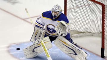 Mar 24, 2021; Pittsburgh, Pennsylvania, USA; Buffalo Sabres goaltender Dustin Tokarski (31) warms up before playing the Pittsburgh Penguins at PPG Paints Arena. Mandatory Credit: Charles LeClaire-USA TODAY Sports