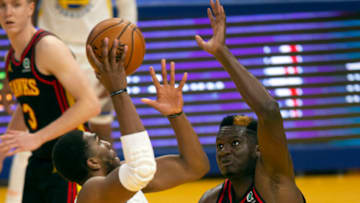 Mar 26, 2021; San Francisco, California, USA; Atlanta Hawks center Clint Capela (15) defends against Golden State Warriors forward Kevon Looney (5) during the third quarter of an NBA basketball game at Chase Center. Mandatory Credit: D. Ross Cameron-USA TODAY Sports