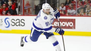 Feb 21, 2016; Raleigh, NC, USA; Tampa Bay Lightning forward Steven Stamkos (91) third period shot scores the winning goal against the Carolina Hurricanes at PNC Arena. The Tampa Bay Lightning defeated the Carolina Hurricanes 4-2. Mandatory Credit: James Guillory-USA TODAY Sports