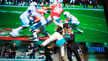 NASHVILLE, TENNESSEE - APRIL 25: Christian Wilkins of Clemson celebrates with NFL Commissioner Roger Goodell after being chosen #13 overall by the Miami Dolphins during the first round of the 2019 NFL Draft on April 25, 2019 in Nashville, Tennessee. (Photo by Andy Lyons/Getty Images)