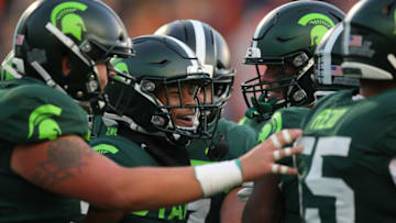 EAST LANSING, MICHIGAN - NOVEMBER 09: Tre Mosley #17 of the Michigan State Spartans celebrates his first half touchdown catch with teammates while playing the Illinois Fighting Illini at Spartan Stadium on November 09, 2019 in East Lansing, Michigan. (Photo by Gregory Shamus/Getty Images)