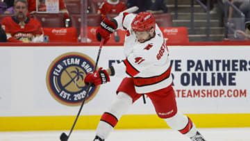 Apr 13, 2023; Sunrise, Florida, USA; Carolina Hurricanes defenseman Shayne Gostisbehere (41) shoots the puck during the first period against the Florida Panthers at FLA Live Arena. Mandatory Credit: Sam Navarro-USA TODAY Sports