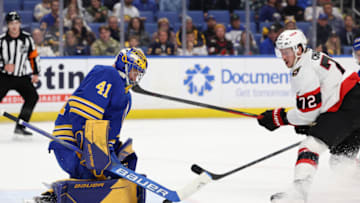 Oct 13, 2022; Buffalo, New York, USA; Buffalo Sabres goaltender Craig Anderson (41) makes a save as Ottawa Senators defenseman Thomas Chabot (72) looks for the loose puck during the first period at KeyBank Center. Mandatory Credit: Timothy T. Ludwig-USA TODAY Sports