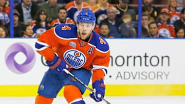 Mar 18, 2016; Edmonton, Alberta, CAN; Edmonton Oilers forward Taylor Hall (4) takes a shot against the Vancouver Canucks at Rexall Place. Mandatory Credit: Perry Nelson-USA TODAY Sports
