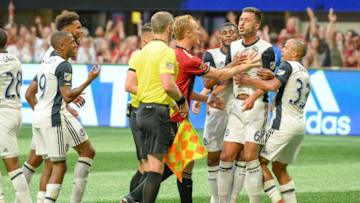 ATLANTA, GA JUNE 02: The referee issues a red card to Philadelphia's Haris Medunjanin (6) during the match between Atlanta and Philadelphia on June 2, 2018 at Mercedes-Benz Stadium in Atlanta, GA. Atlanta United FC defeated Philadelphia Union 3 1. (Photo by Rich von Biberstein/Icon Sportswire via Getty Images)