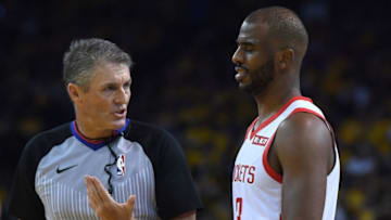 OAKLAND, CA - APRIL 30: Referee Scott Foster #48 talks over a foul call made on Chris Paul #3 of the Houston Rockets against the Golden State Warriors in Game Two of the Second Round of the 2019 NBA Western Conference Playoffs at ORACLE Arena on April 30, 2019 in Oakland, California. NOTE TO USER: User expressly acknowledges and agrees that, by downloading and or using this photograph, User is consenting to the terms and conditions of the Getty Images License Agreement. (Photo by Thearon W. Henderson/Getty Images)