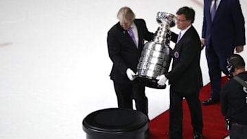 NASHVILLE, TN - JUNE 11: Craig Campbell (right) and Philip Pritchard (left) carry the Stanley Cup onto the ice after the Pittsburgh Penguins 2-0 victory to win the Stanley Cup against the Nashville Predators in Game Six of the 2017 NHL Stanley Cup Final at the Bridgestone Arena on June 11, 2017 in Nashville, Tennessee. (Photo by Patrick Smith/Getty Images)