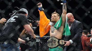 December 12, 2015; Las Vegas, NV, USA; Conor McGregor is declared the winner by knockout and crowned champion against Jose Aldo during UFC 194 at MGM Grand Garden Arena. Mandatory Credit: Gary A. Vasquez-USA TODAY Sports
