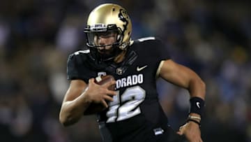 BOULDER, CO - SEPTEMBER 28: Quarterback Steven Montez #12 of the Colorado Buffaloes carries the ball for a touchdown ion the fourth quarter against the UCLA Bruins at Folsom Field on September 28, 2018 in Boulder, Colorado. (Photo by Matthew Stockman/Getty Images)