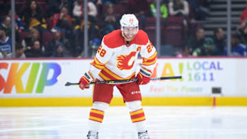 VANCOUVER, CANADA - MARCH 31: Elias Lindholm #28 of the Calgary Flames waits for a face-off during the second period of their NHL game against the Vancouver Canucks at Rogers Arena on March 31, 2023 in Vancouver, British Columbia, Canada. (Photo by Derek Cain/Getty Images)