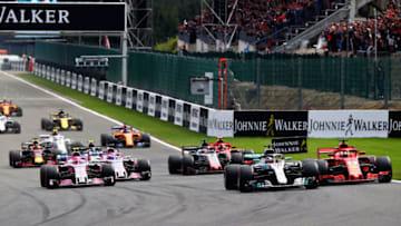 SPA, BELGIUM - AUGUST 26: Lewis Hamilton of Great Britain driving the (44) Mercedes AMG Petronas F1 Team Mercedes WO9 and Sebastian Vettel of Germany driving the (5) Scuderia Ferrari SF71H battle for position at the start during the Formula One Grand Prix of Belgium at Circuit de Spa-Francorchamps on August 26, 2018 in Spa, Belgium. (Photo by Mark Thompson/Getty Images)