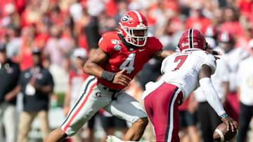 ATHENS, GA - OCTOBER 12: Nolan Smith #4 of the Georgia Bulldogs tackles Dakereon Joyner #7 of the South Carolina Gamecocks during a game between University of South Carolina Gamecocks and University of Georgia Bulldogs at Sanford Stadium on October 12, 2019 in Athens, Georgia. (Photo by Steve Limentani/ISI Photos/Getty Images).