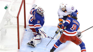 TORONTO, ONTARIO - JULY 29: Igor Shesterkin #31 of the New York Rangers stops a shot by Mathew Barzal #13 of the New York Islanders as Jacob Trouba #8 of the New York Rangers defends in the second period during an exhibition game prior to the 2020 NHL Stanley Cup Playoffs at Scotiabank Arena on July 29, 2020 in Toronto, Ontario. (Photo by Andre Ringuette/Freestyle Photo/Getty Images)