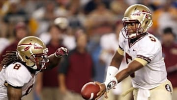Sep 2, 2013; Pittsburgh, PA, USA; Florida State Seminoles quarterback Jameis Winston (5) hands off to running back Devonta Freeman (8) against the Pittsburgh Panthers during the second quarter at Heinz Field. Mandatory Credit: Charles LeClaire-USA TODAY Sports