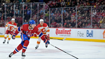 Nov 14, 2023; Montreal, Quebec, CAN; Montreal Canadiens forward Jake Evans (71) chases the puck during the first period of the game against the Calgary Flames at the Bell Centre. Mandatory Credit: Eric Bolte-USA TODAY Sports