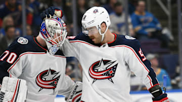 ST. LOUIS, MO - OCTOBER 25: Columbus Blue Jackets defenseman David Savard (58) congratulates Columbus Blue Jackets goalie Joonas Korpisalo (70) after winning a NHL game between the Columbus Blue Jackets and the St. Louis Blues on October 25, 2018, at Enterprise Center, St. Louis, MO. Columbus beat St. Louis 7-4. (Photo by Keith Gillett/Icon Sportswire via Getty Images)