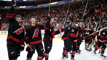 RALEIGH, NC - MAY 03: Jordan Martinook #48 of the Carolina Hurricanes and teammate Patrick Brown #36 celebrate following a victory over the New York Islanders in Game Four of the Eastern Conference Second Round during the 2019 NHL Stanley Cup Playoffs on May 3, 2019 at PNC Arena in Raleigh, North Carolina. (Photo by Gregg Forwerck/NHLI via Getty Images)