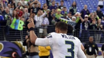 Dec 13, 2015; Baltimore, MD, USA; Seattle Seahawks quarterback Russell Wilson (3) runs off the field after he and his teammates defeated Baltimore Ravens 35-6 at M&T Bank Stadium. Mandatory Credit: Tommy Gilligan-USA TODAY Sports