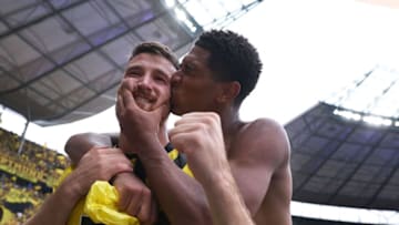 Salih Özcan with Jude Bellingham after the game (Photo by RONNY HARTMANN/AFP via Getty Images)