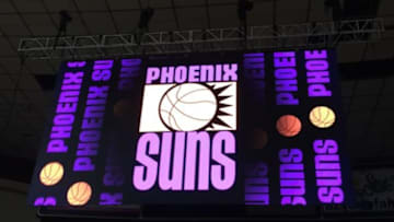 Oct 3, 2015; Phoenix, AZ, USA; An old Phoenix Suns logo is displayed on the video board at a free scrimmage at the Arizona Veterans Memorial Coliseum. Mandatory Credit: Gerald Bourguet-Valley of the Suns