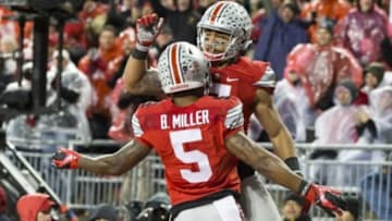 Nov 21, 2015; Columbus, OH, USA; Ohio State Buckeyes wide receiver Braxton Miller (5) congratulates running back Jalin Marshall (7) after his touchdown against the Michigan State Spartans at Ohio Stadium. Mandatory Credit: Greg Bartram-USA TODAY Sports