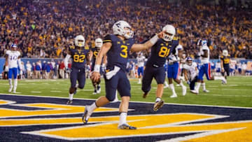Nov 5, 2016; Morgantown, WV, USA; West Virginia Mountaineers quarterback Skyler Howard (3) runs for a touchdown during the second quarter against the Kansas Jayhawks at Milan Puskar Stadium. Mandatory Credit: Ben Queen-USA TODAY Sports