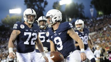 January 2, 2017; Pasadena, CA, USA; Penn State Nittany Lions quarterback Trace McSorley (9) celebrates after he runs the ball in for a touchdown against the Southern California Trojans during the second half of the 2017 Rose Bowl game at the Rose Bowl. Mandatory Credit: Gary A. Vasquez-USA TODAY Sports
