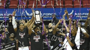 LAS VEGAS, NEVADA - MARCH 13: The San Diego State Aztecs celebrate their 68-57 victory over the Utah State Aggies in the championship game of the Mountain West Conference basketball tournament at the Thomas & Mack Center on March 13, 2021 in Las Vegas, Nevada. (Photo by David Becker/Getty Images)