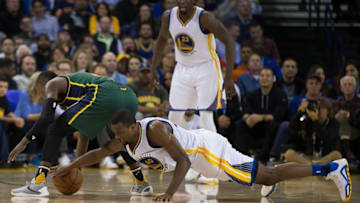 Mar 9, 2016; Oakland, CA, USA; Golden State Warriors forward Harrison Barnes (40) and Utah Jazz guard Shelvin Mack (8) battle for the ball during the second quarter at Oracle Arena. Mandatory Credit: Kelley L Cox-USA TODAY Sports