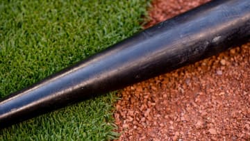 MIAMI, FL - MARCH 29: A detailed view of a bat lying in the grass and dirt before the game between the Miami Marlins and the Chicago Cubs at Marlins Park on March 30, 2018 in Miami, Florida. (Photo by Rob Foldy/Miami Marlins via Getty Images)