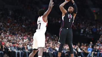 Oct 27, 2016; Portland, OR, USA; Los Angeles Clippers center Marreese Speights (5) shoots over Portland Trail Blazers forward Ed Davis (17) in the first half at Moda Center. Mandatory Credit: Jaime Valdez-USA TODAY Sports