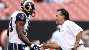 Aug 8, 2013; Cleveland, OH, USA; St. Louis Rams head coach Jeff Fisher, right, shakes hands with St. Louis Rams tight end Jared Cook (89) during warm ups before a game against the Cleveland Browns at FirstEnergy Field. Mandatory Credit: Ron Schwane-USA TODAY Sports