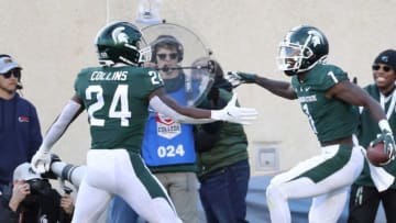 Michigan State Spartans wide receiver Jayden Reed (1) celebrates his touchdown with running back Elijah Collins (24) during the first half at Spartan Stadium Saturday, October 8, 2022.Msuosu 100822 Kd 0013233