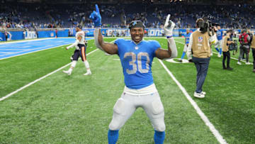 DETROIT, MICHIGAN - JANUARY 01: Jamaal Williams #30 of the Detroit Lions celebrates on the field after a win over the Chicago Bears at Ford Field on January 01, 2023 in Detroit, Michigan. (Photo by Nic Antaya/Getty Images)
