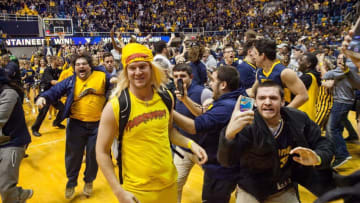 Jan 10, 2017; Morgantown, WV, USA; West Virginia Mountaineers students rush the floor after beating the Baylor Bears at WVU Coliseum. Mandatory Credit: Ben Queen-USA TODAY Sports
