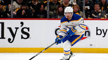 Nov 11, 2023; Pittsburgh, Pennsylvania, USA; Buffalo Sabres defenseman Connor Clifton (75) skates with the puck against the Pittsburgh Penguins during the second period at PPG Paints Arena. Mandatory Credit: Charles LeClaire-USA TODAY Sports