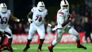 Dec 5, 2013; Cincinnati, OH, USA; Louisville Cardinals wide receiver DeVante Parker (9) makes a catch and runs for a touchdown during the first quarter against the Cincinnati Bearcats at Nippert Stadium. Mandatory Credit: Andrew Weber-USA TODAY Sports