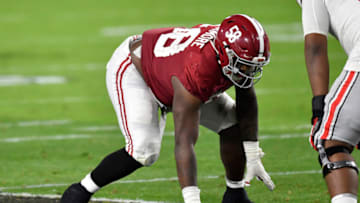 MIAMI GARDENS, FLORIDA - JANUARY 11: Christian Barmore #58 of the Alabama Crimson Tide sits in his stance during the College Football Playoff National Championship football game against the Ohio State Buckeyes at Hard Rock Stadium on January 11, 2021 in Miami Gardens, Florida. The Alabama Crimson Tide defeated the Ohio State Buckeyes 52-24. (Photo by Alika Jenner/Getty Images)