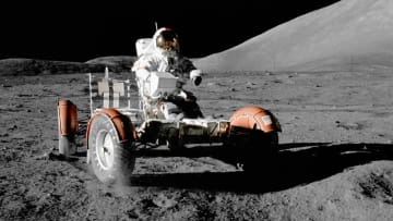 Astronaut Eugene A. Cernan mans a Lunar Roving Vehicle during the Apollo 17 mission.