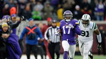 MINNEAPOLIS, MN - DECEMBER 7: Jarius Wright #17 of the Minnesota Vikings carries the ball for a touchdown as Sheldon Richardson #91 gives chase during overtime of the New York Jets of the game on December 7, 2014 at TCF Bank Stadium in Minneapolis, Minnesota. The Vikings defeated the Jets 30-24. (Photo by Hannah Foslien/Getty Images)