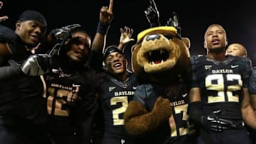 Nov 7, 2013; Waco, TX, USA; Baylor Bear mascot Bruiser celebrates with the team after the game against the Oklahoma Sooners at Floyd Casey Stadium.Baylor beat Oklahoma 41-12. Mandatory Credit: Tim Heitman-USA TODAY Sports