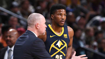 DENVER, CO - MARCH 7: Michael Malone and Malik Beasley #25 of the Denver Nuggets talk during the game against the Cleveland Cavaliers on March 7, 2018 at the Pepsi Center in Denver, Colorado. NOTE TO USER: User expressly acknowledges and agrees that, by downloading and/or using this Photograph, user is consenting to the terms and conditions of the Getty Images License Agreement. Mandatory Copyright Notice: Copyright 2018 NBAE (Photo by Garrett Ellwood/NBAE via Getty Images)