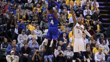 Oct 29, 2014; Indianapolis, IN, USA; Philadelphia 76ers center Nerlens Noel (4) takes a shot against Indiana Pacers forward Lavoy Allen (5) at Bankers Life Fieldhouse. Indiana defeats Philadelphia 103-91. Mandatory Credit: Brian Spurlock-USA TODAY Sports