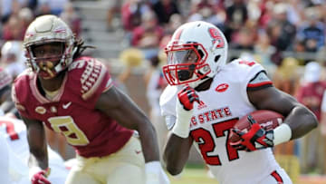 Nov 14, 2015; Tallahassee, FL, USA; Florida State University defensive end Josh Sweat (9) chases down North Carolina State Wolfpack running back Dakwa Nichols (27) during the first half of the game at Doak Campbell Stadium. Mandatory Credit: Melina Vastola-USA TODAY Sports