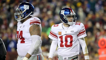 LANDOVER, MD - NOVEMBER 23: Quarterback Eli Manning No. 10 of the New York Giants and the offense leave the field after failing to convert a first down in the second half against the Washington Redskins at FedExField on November 23, 2017 in Landover, Maryland. (Photo by Rob Carr/Getty Images)