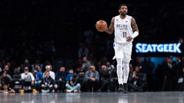 NEW YORK, NEW YORK - JANUARY 28: Kyrie Irving #11 of the Brooklyn Nets brings the ball up the court during the first quarter of the game against the New York Knicks at Barclays Center on January 28, 2023 in New York City. NOTE TO USER: User expressly acknowledges and agrees that, by downloading and or using this photograph, User is consenting to the terms and conditions of the Getty Images License Agreement. (Photo by Dustin Satloff/Getty Images)