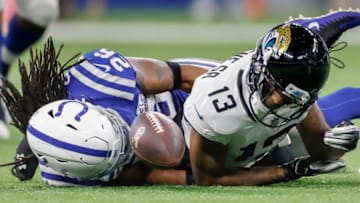 INDIANAPOLIS, IN - NOVEMBER 11: Rashad Greene #13 of the Jacksonville Jaguars fumbles the football as Clayton Geathers #26 of the Indianapolis Colts makes the tackle sealing the game for Indianapolis at Lucas Oil Stadium on November 11, 2018 in Indianapolis, Indiana. (Photo by Michael Hickey/Getty Images)