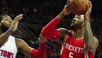 Jan 31, 2015; Auburn Hills, MI, USA; Houston Rockets forward Josh Smith (5) looks to take a shot against Detroit Pistons center Andre Drummond (0) during the first quarter at The Palace of Auburn Hills. Mandatory Credit: Raj Mehta-USA TODAY Sports